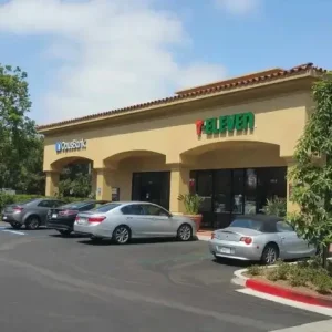 Multi-tenant retail center painting at Westpark Plaza featuring clean, updated storefronts.